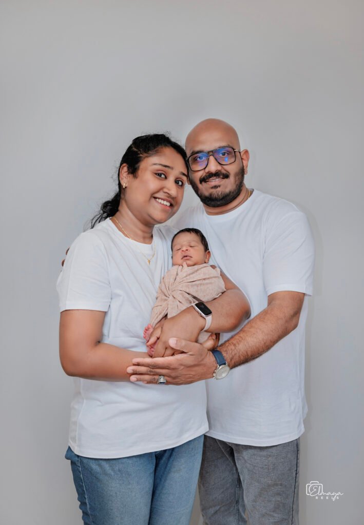 Parents holding their newborn baby – family portrait photography in Cork